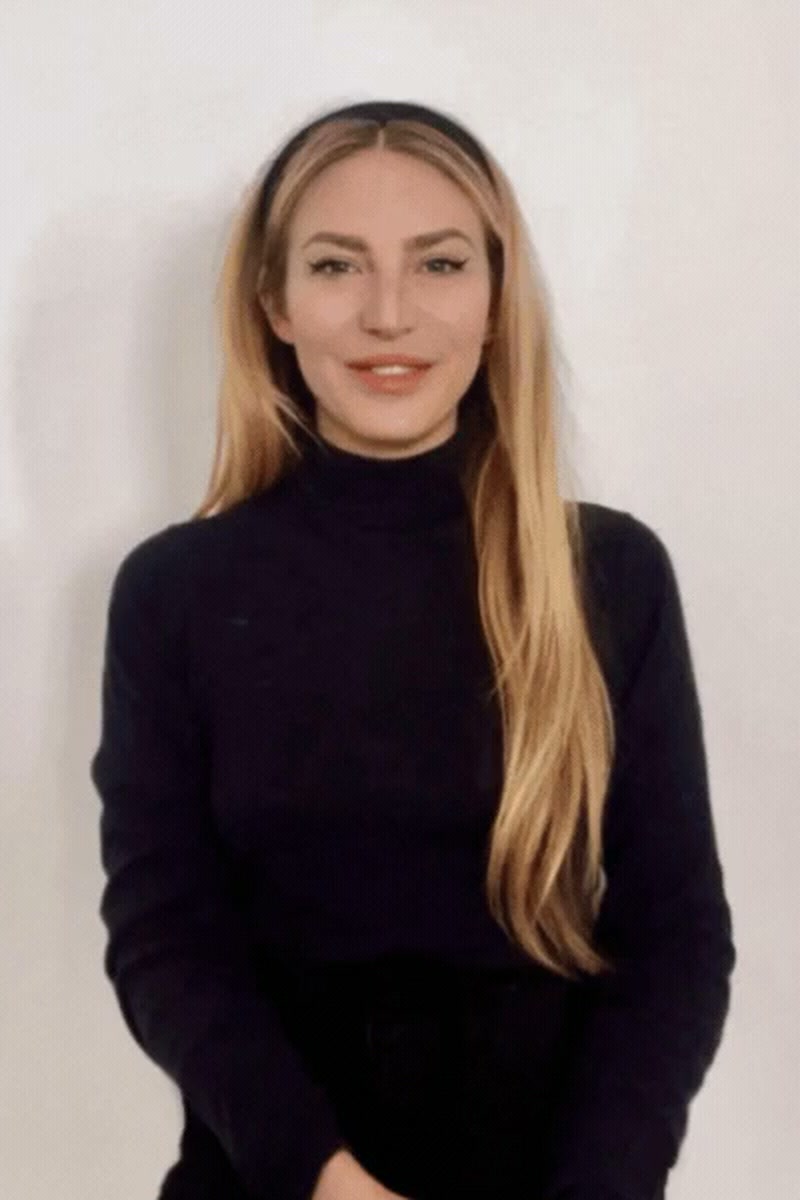 Photograph of Emma Pulbrook in a black high-neck top